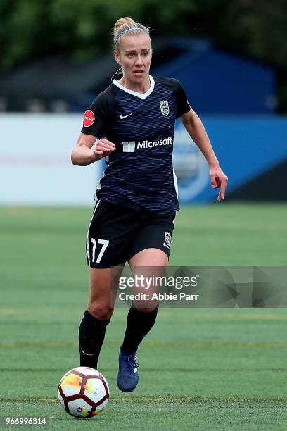 Beverly Yanez of Seattle Reign FC dribbles with the ball in the first half against the Orlando Pride during their game at Memorial Stadium on June 3,...