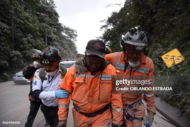 Volunteer firefighter cries after leaving El Rodeo village in Escuintla department, 35 km south of Guatemala City on June 3 following the eruption of...