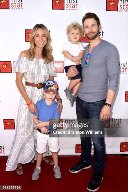 From L-R: Model Julianna Geldien, sons Jaxon Schmidt and Caden Schmidt, and actor Brad Schmidt attend First Star's 14th Annual Celebration at...