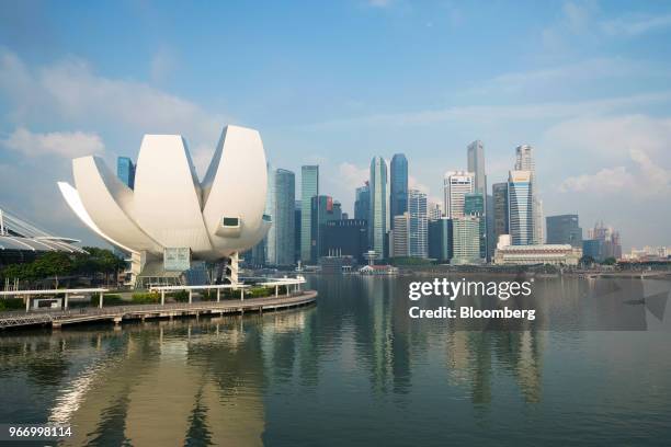 The ArtScience Museum, left, and commercial buildings in the central business district stand along the Marina Bay waterfront in Singapore, on Sunday,...