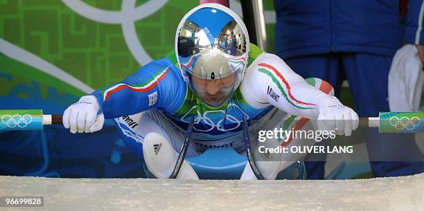 Italy's Armin Zoeggeler prepares to take the start of the men's luge singles run 3 at the Whistler sliding centre on February 14, 2010 during the...