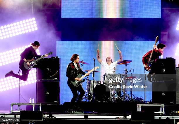 Michael Cliffford, Luke Hemmings, Ashton Irwin and Calum Hood of the music group 5 Seconds of Summer perform onstage during the 2018 iHeartRadio by...