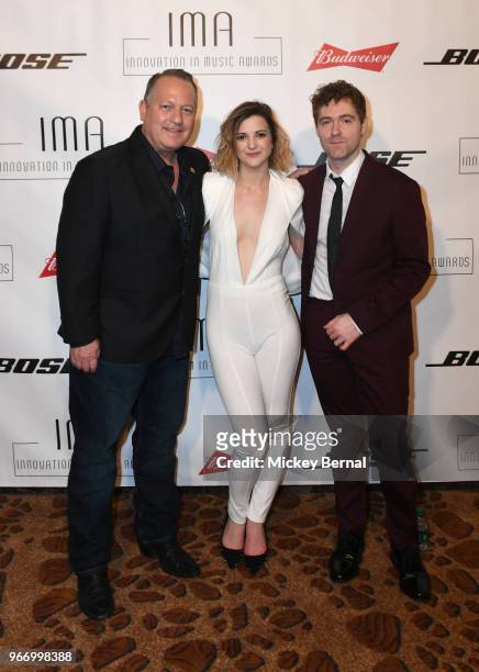 Pete O'Heeron, artists Sarah Zimmermann, and Justin Davis of musical group Striking Matches backstage at the Innovation In Music Awards on June 3,...