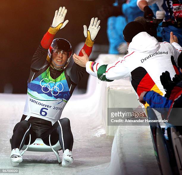 David Moeller of Germany celebrates winning the silver medal after finishing the final run of the men's luge singles final on day 3 of the 2010...