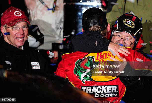 Jamie McMurray, driver of the Bass Pro Shops/Tracker Boats Chevrolet, hugs Tony Glover, team manager for Chip Ganassi Racing, as he celebrates in...