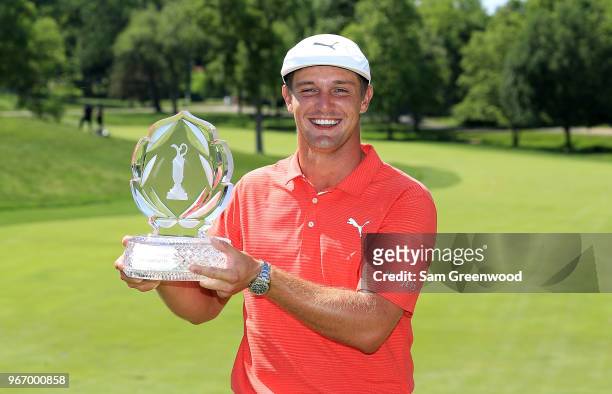 Bryson DeChambeau poses with the trophy after winning The Memorial Tournament Presented By Nationwide at Muirfield Village Golf Club on June 3, 2018...