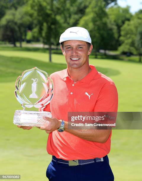 Bryson DeChambeau poses with the trophy after winning The Memorial Tournament Presented By Nationwide at Muirfield Village Golf Club on June 3, 2018...