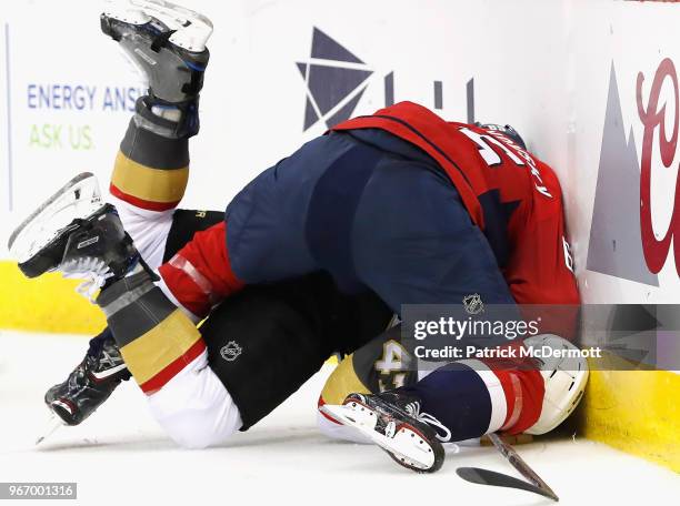 Andre Burakovsky of the Washington Capitals tackled Luca Sbisa of the Vegas Golden Knights to the ice during Game Three of the 2018 NHL Stanley Cup...