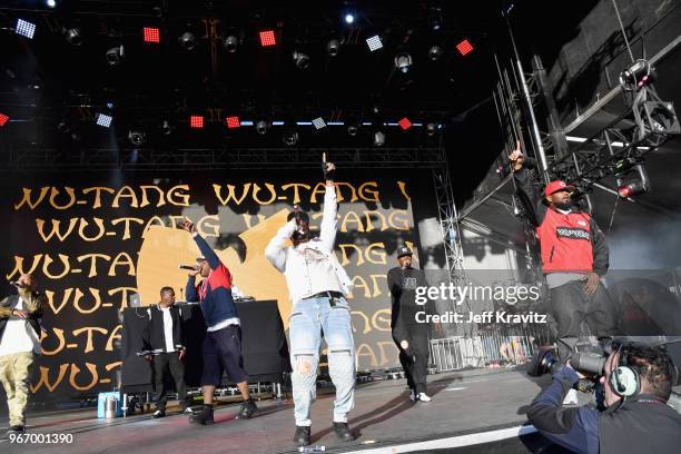 God, GZA, Cappadonna, RZA, Inspectah Deck and Ghostface Killah of Wu-Tang Clan perform on the Colossal Stage during Clusterfest at Civic Center Plaza...