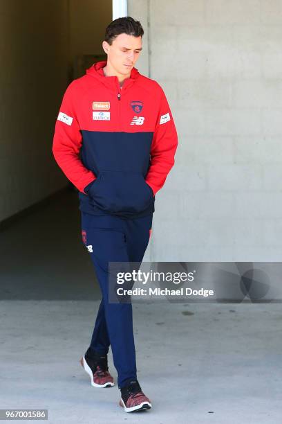 Jake Lever of the Demons walks out to face a media conference during a Melbourne Demons AFL training session at AAMI Park on June 4, 2018 in...