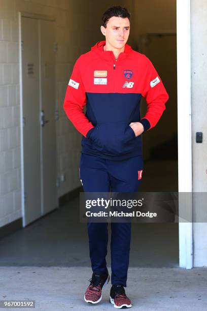 Jake Lever of the Demons walks out to face a media conference during a Melbourne Demons AFL training session at AAMI Park on June 4, 2018 in...