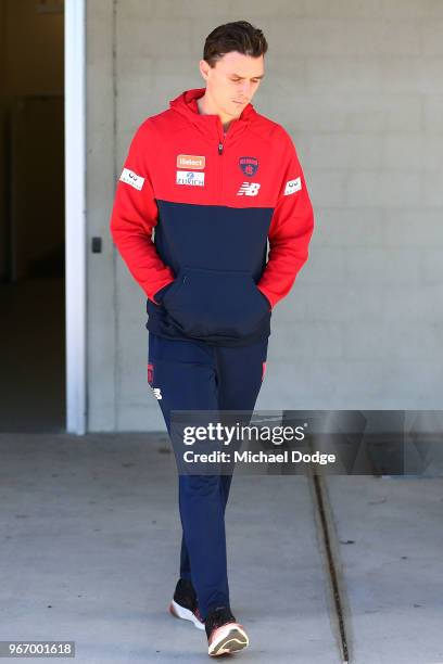 Dejected Jake Lever of the Demons walks out to face a media conference during a Melbourne Demons AFL training session at AAMI Park on June 4, 2018 in...