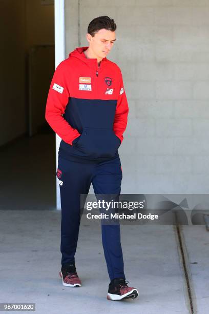 Dejected Jake Lever of the Demons walks out to face a media conference during a Melbourne Demons AFL training session at AAMI Park on June 4, 2018 in...