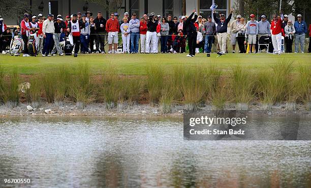 Tommy Armour III hits across the lake to the 15th green during the final round of The ACE Group Classic at The Quarry on February 14, 2010 in Naples,...