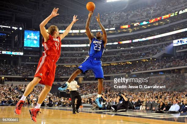 LeBron James of the Eastern Conference shoots against Dirk Nowitzki of the Western Conference during the NBA All-Star Game, part of 2010 NBA All-Star...