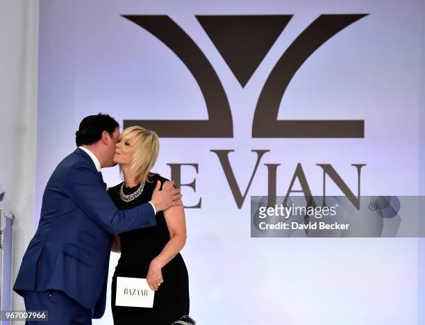 Eddie LeVian and Harper's Bazaar Executive Beauty and Fashion Editor Avril Graham appear on stage during the Le Vian 2019 Red Carpet Revue at the...