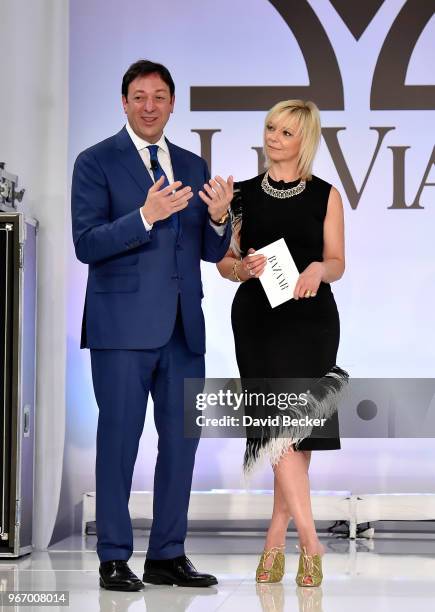 Eddie LeVian and Harper's Bazaar Executive Beauty and Fashion Editor Avril Graham appear on stage during the Le Vian 2019 Red Carpet Revue at the...