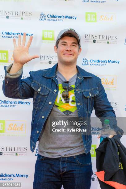 Adam Devine walks the Red Carpet before participating in bowling at Pinstripes during the Big Slick Celebrity Weekend benefitting Children's Mercy...