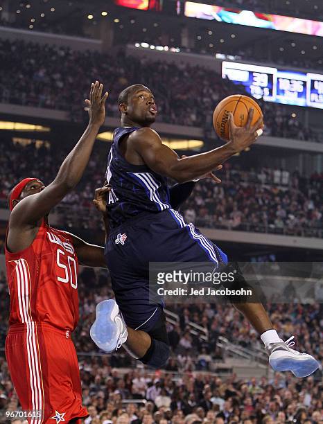 Dwyane Wade of the Eastern Conference goes up for a shot against Zach Randolph of the Western Conference during the first half of the NBA All-Star...