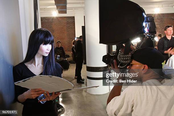 Photographer shoots a model backstage at the Erin Fetherston Fall/Winter 2010 fashion show at Milk Studios on February 14, 2010 in New York City.