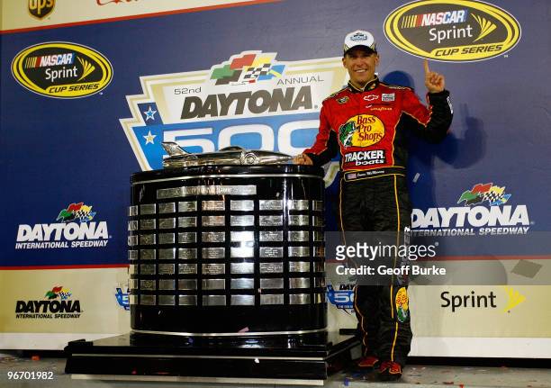 Jamie McMurray, driver of the Bass Pro Shops/Tracker Boats Chevrolet, celebrates in Victory Lane after winning the NASCAR Sprint Cup Series Daytona...