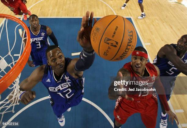 Dwight Howard of the Eastern Conference rebounds against Carmelo Anthony of the Western Conference during the first half of the NBA All-Star Game,...