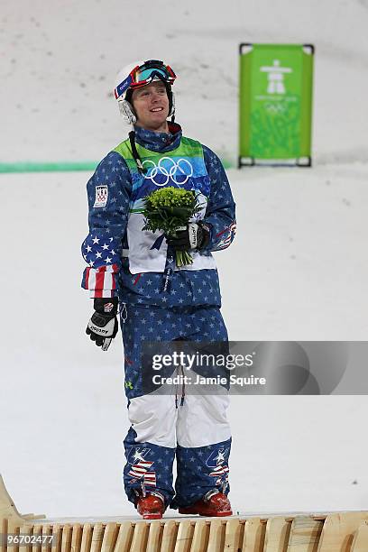 Bryon Wilson of United States celebrates winning bronze during the flower ceremony for the Freestyle Skiing Men's Moguls on day 3 of the 2010 Winter...