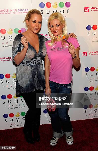 Television personalities Kendra Wilkinson Baskett and Holly Madison arrive for the grand opening of the Sugar Factory inside the Miracle Mile Shops...