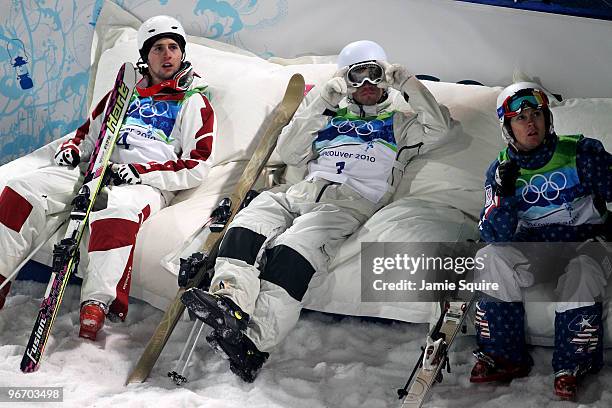 Gold medalist Alexandre Bilodeau of Canada sits with Dale Begg-Smith of Australia and Bryon Wilson of United States during the Freestyle Skiing Men's...