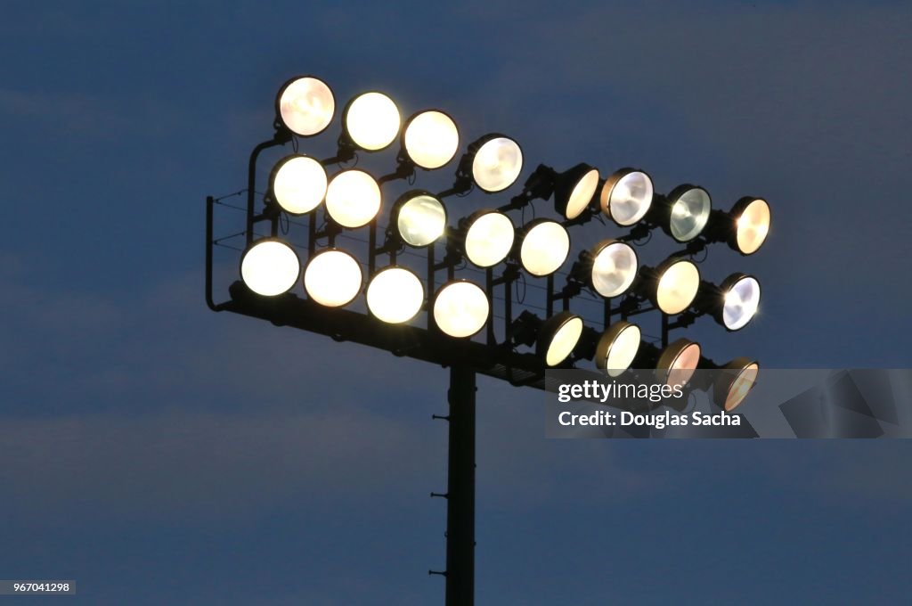 Illuminated overhead stadium scene lights