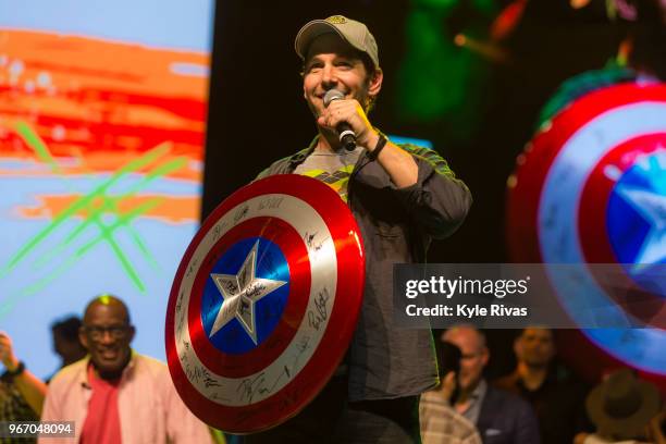 Paul Rudd auctions off a Captain America shield signed by all of the Avengers cast in the Celebrity Auction at Midland Theater during the Big Slick...