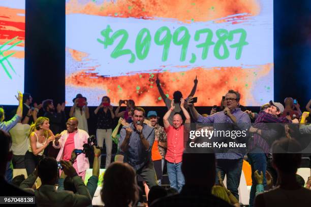 Rob Riggle, David Koechner, Eric Stonestreet and all celebrity attendees celebrate the announcement of the final donated amount in the Celebrity...