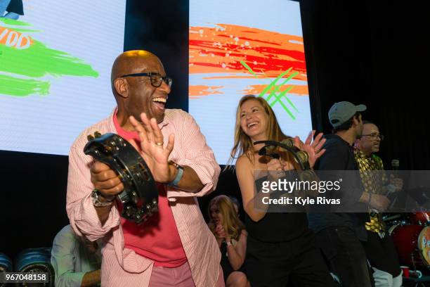 Angela Kinsey and Al Roker celebrate the announcement of the total donated amount in the Celebrity Auction at Midland Theater during the Big Slick...
