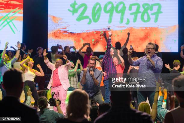 Rob Riggle, David Koechner, Eric Stonestreet and all celebrity attendees celebrate the announcement of the final donated amount in the Celebrity...