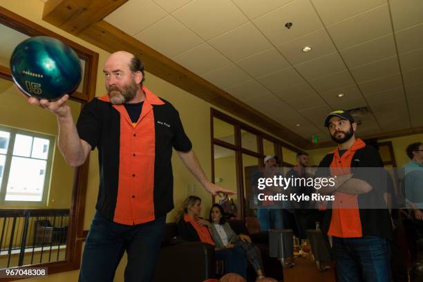 David Koechner prepares to bowl while Samm Levine looks on at Pinstripes during the Big Slick Celebrity Weekend benefitting Children's Mercy Hospital...
