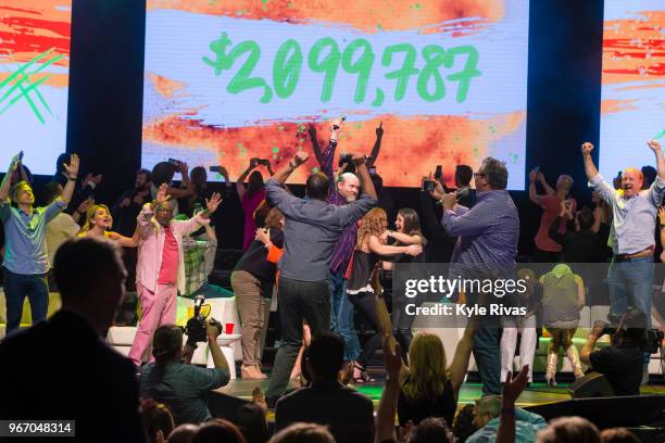 Rob Riggle, David Koechner, Eric Stonestreet and all celebrity attendees celebrate the announcement of the final donated amount in the Celebrity...