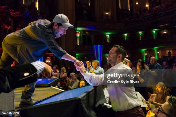 Paul Rudd thanks a major donor at the Celebrity Auction at Midland Theater during the Big Slick Celebrity Weekend benefitting Children's Mercy...