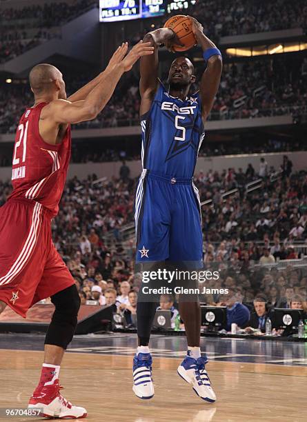 Kevin Garnett of the Eastern Conference shoots a jumper against Tim Duncan of the Western Conference during the NBA All-Star Game as part of the 2010...