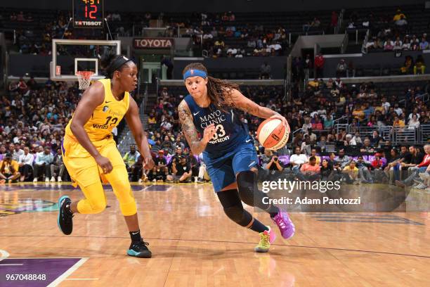 Seimone Augustus of the Minnesota Lynx handles the ball against Chelsea Gray of the Los Angeles Sparks on June 3, 2018 at STAPLES Center in Los...