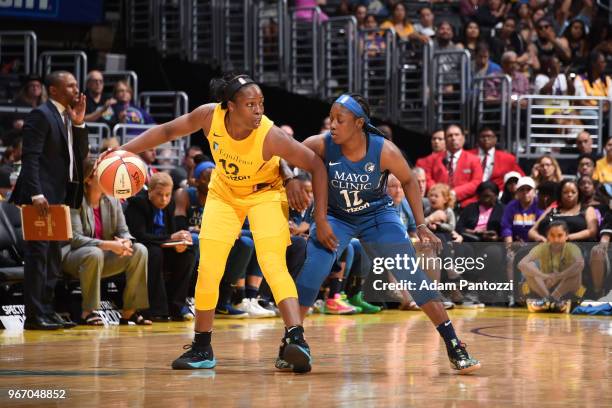 Chelsea Gray of the Los Angeles Sparks handles the ball against Alexis Jones of the Minnesota Lynx on June 3, 2018 at STAPLES Center in Los Angeles,...