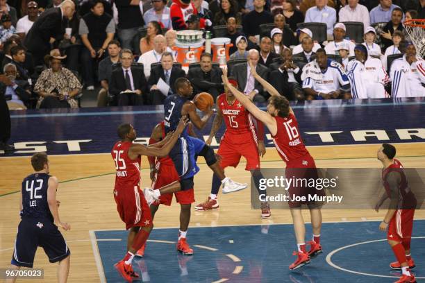 Dwyane Wade of the Eastern Conference shoots the ball over Pau Gasol of the Western Conference during the NBA All-Star Game as part of the 2010 NBA...