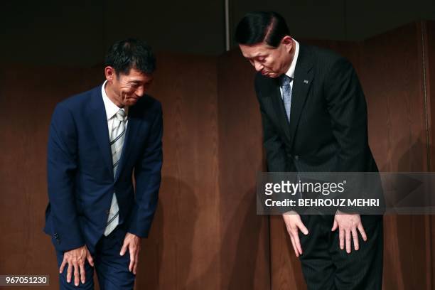 Toshiba Memory Corp. President Yasuo Naruke and head of Bain Capital's operations in Japan, Yuji Sugimoto , bow at the end of a joint press...