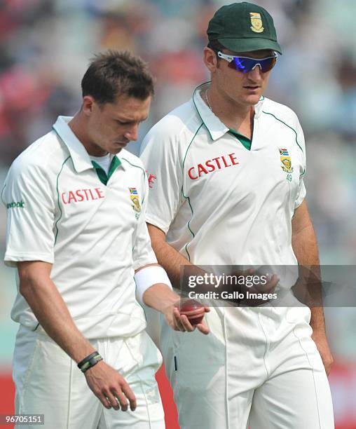 Graeme Smith of South Africa and team mate Dale Steyn talk during day two of the Second Test match between India and South Africa at Eden Gardens on...