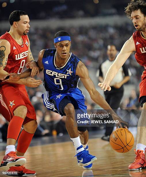 Rajon Rondo of the Eastern Conference dodges Pau Gasol and Deron Williams of the Western Conference during the NBA All-Star Game, part of 2010 NBA...