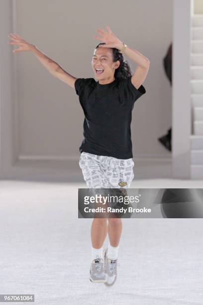 Designer Alexander Wang runs, jumps and waves to the audience after his Alexander Wang Resort Runway show June 2018 New York Fashion Week on June 3,...