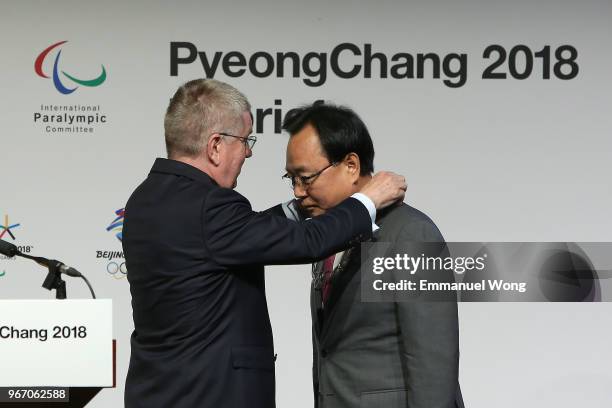 Kim Kihong , the PyeongChang 2018 Vice President of Games Planning is awarded the Olympic Order by the IOC President Thomas Bach during the...