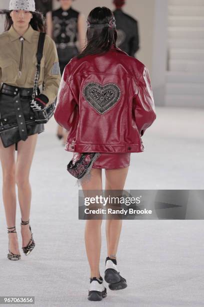An embroidered heart on the back of a red leather jacket during the Alexander Wang Resort Runway show June 2018 New York Fashion Week on June 3, 2018...