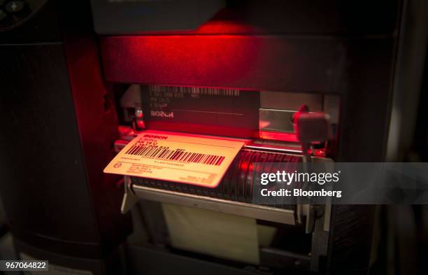 Barcode label hangs from a printer at a Robert Bosch doo Beograd automobile windshield wiper plant in Pecinci, Serbia, on Monday, May 28, 2018. The...