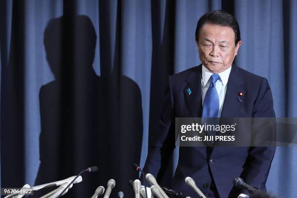 Japan's Finance Minister Taro Aso attends a press conference in Tokyo on June 4, 2018. - Japan's Finance Minister Taro Aso said on June 4 he was...