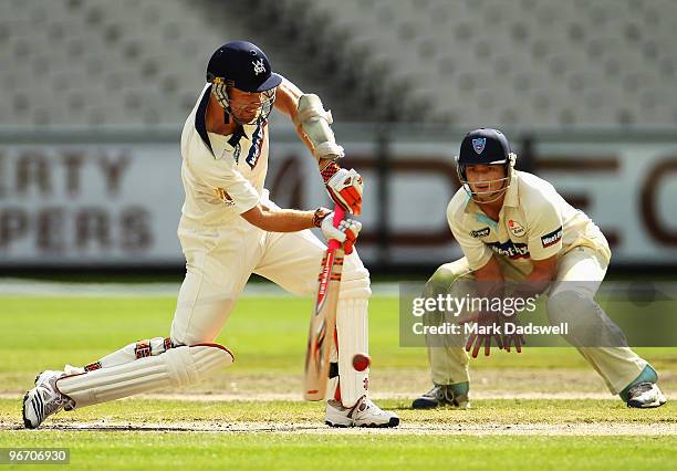 Andrew McDonald of the Bushrangers straight drives during day four of the Sheffield Shield match between the Victorian Bushrangers and the Queensland...